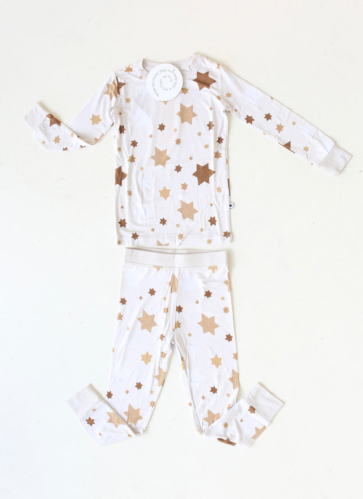 Golden Hour Hanukkah two-piece pajama set with gold Star of David print, shown flat.