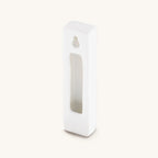 Back of white Grounded Presence ceramic mezuzah case with opening for a scroll