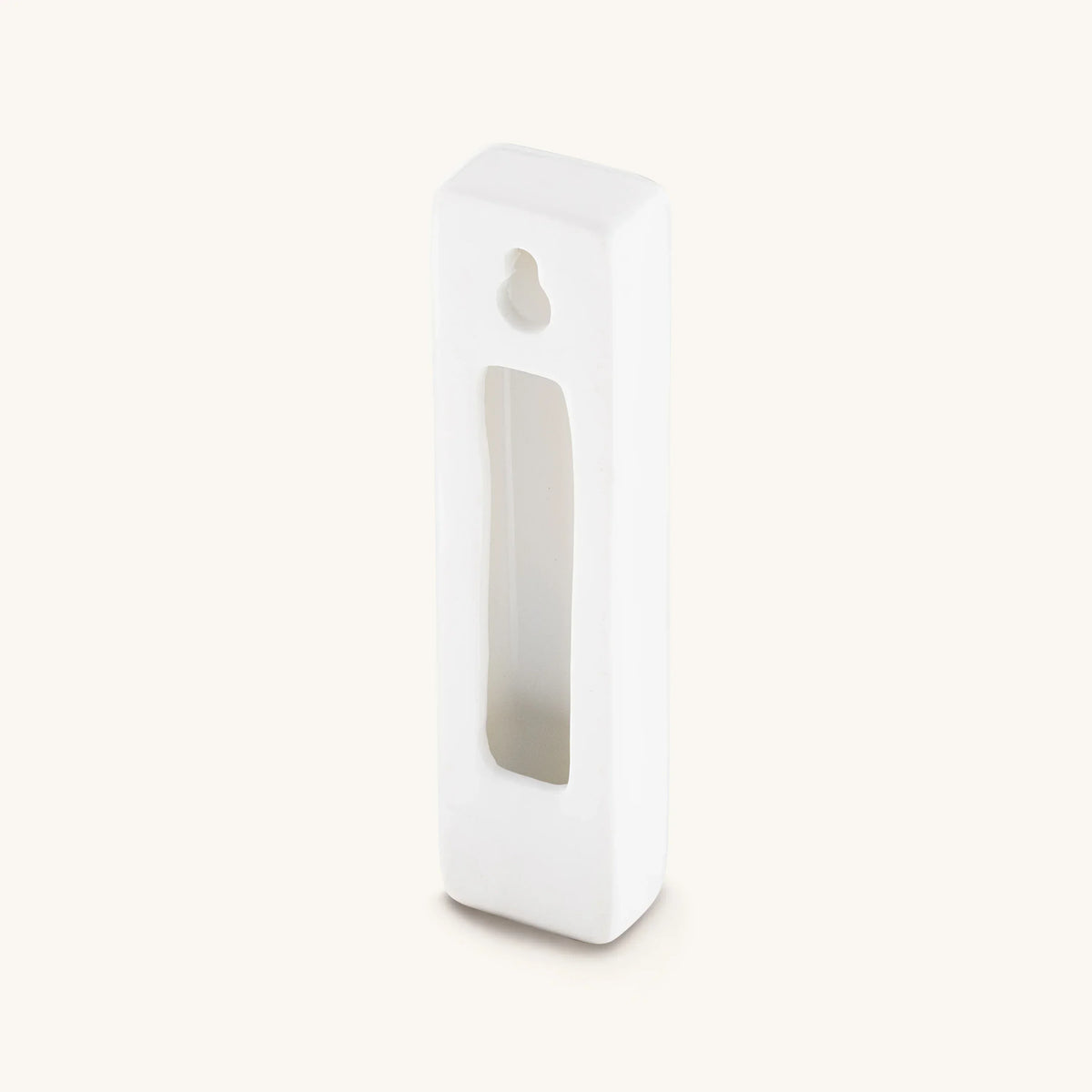 Back of white Grounded Presence ceramic mezuzah case with opening for a scroll