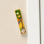 Grounded Presence Tree of Life ceramic mezuzah mounted on a doorway