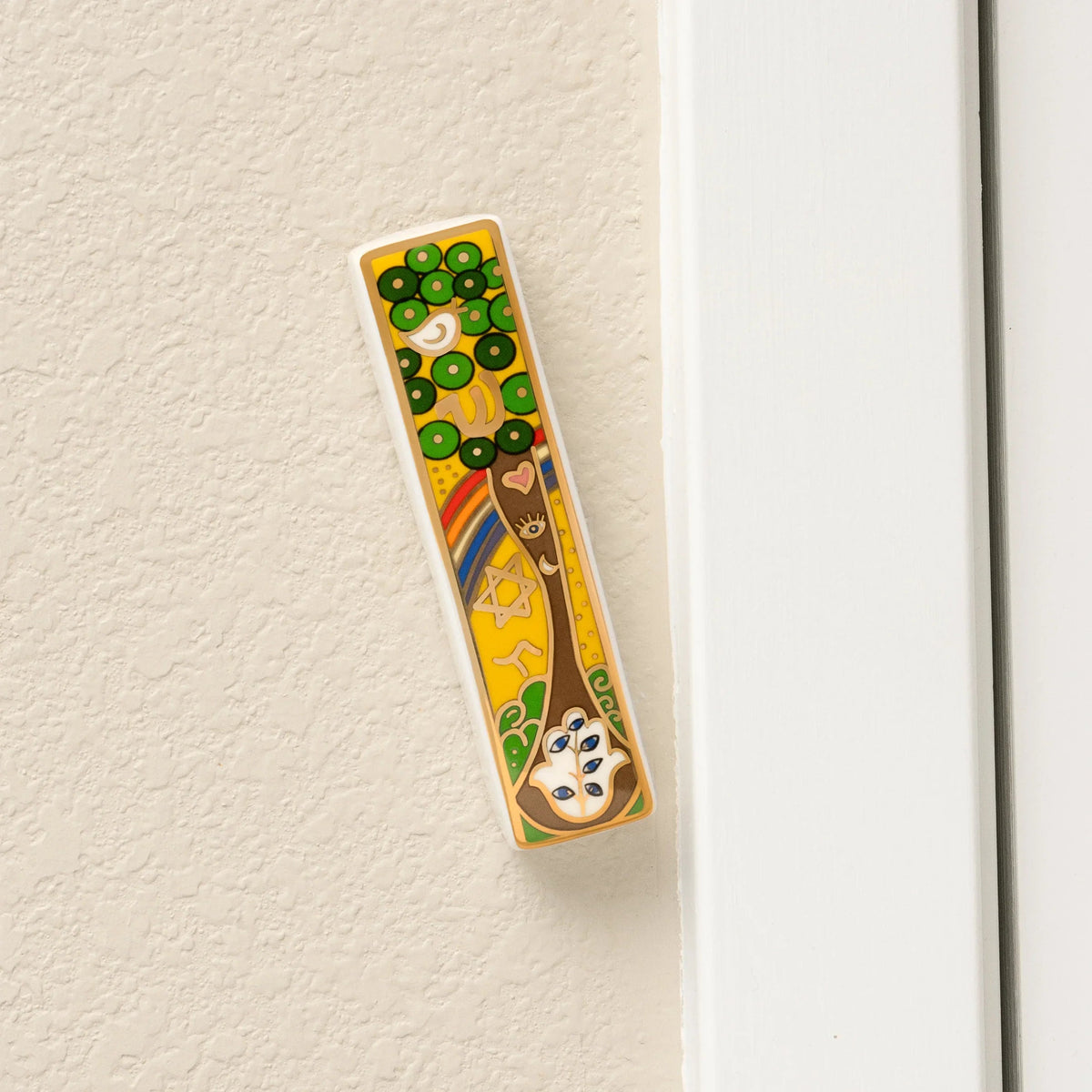 Grounded Presence Tree of Life ceramic mezuzah mounted on a doorway