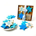 Hanukkah Star of David marzipan conversation tiles in blue, aqua, and cream displayed with their Marzipops gift box.
