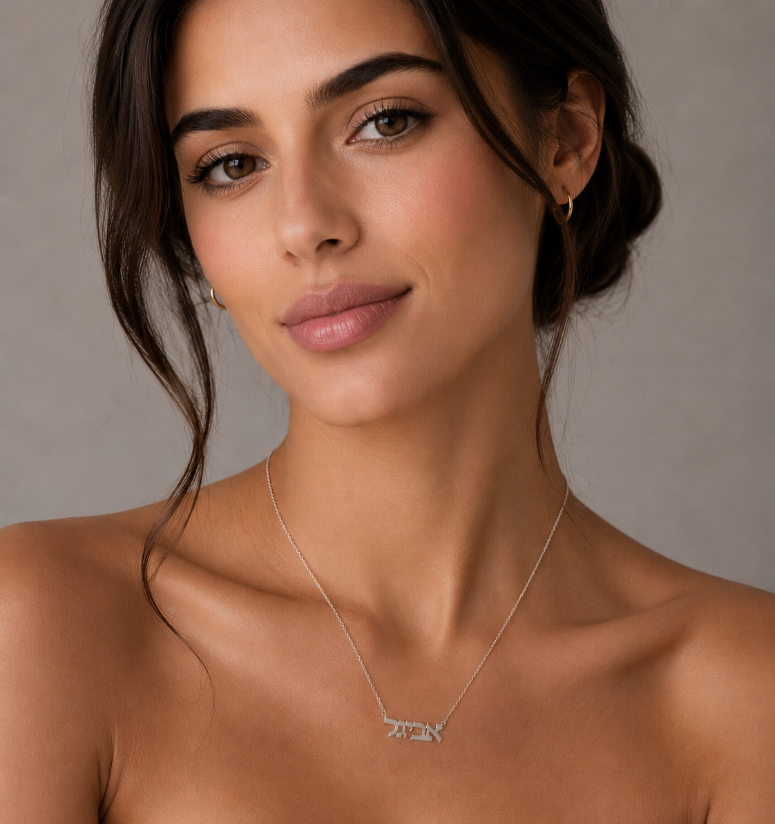Personalized Hebrew nameplate necklace worn by a woman