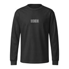 Front product mockup of Washed Black Hineni Reflection garment-dyed heavyweight long-sleeve tee featuring mirrored Hineni artwork