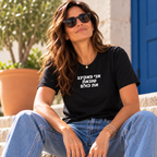 Woman wearing a black I Fucking Hate Everybody T-shirt with bold white Hebrew lettering.