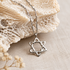 Silver Adi Star of David necklace by Jollori displayed on natural stone