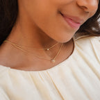 Kids Diamond Flower Necklace worn layered with a delicate gold necklace
