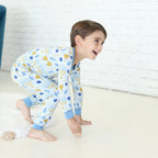 Child wearing the Latkes & Light Hanukkah two-piece set with menorah, dreidel and latke print.