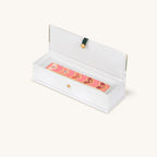 Love Lives Here pink heart mezuzah displayed in open gift box