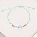 Magia Evil Eye Bracelet with mother-of-pearl evil eye and colorful beads by Shlomit Ofir