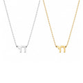Mini Chai Pendant Necklace in sterling silver and gold by Miriam Merenfeld