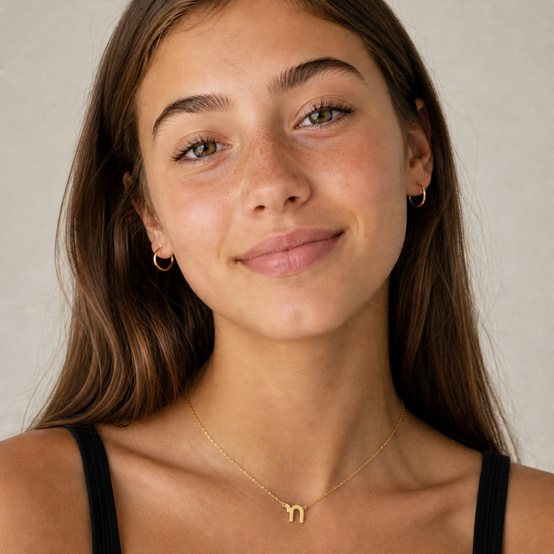 Mini Chai Pendant Necklace worn by a woman