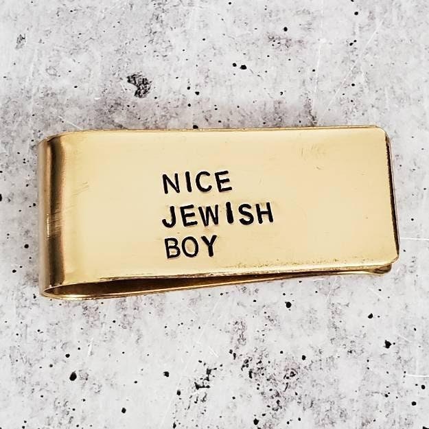Yellow brass money clip hand-stamped with NICE JEWISH BOY lettering by Salt Sparkle Shalom.