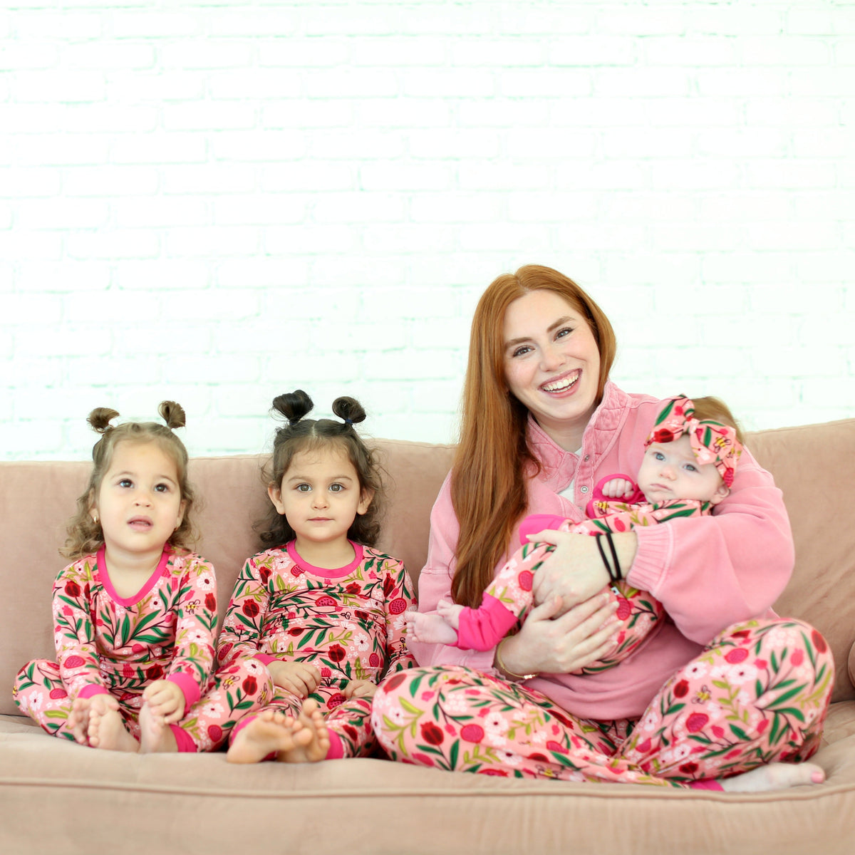 Mother and three children in matching Petals & Pomegranates pajamas for Rosh Hashanah