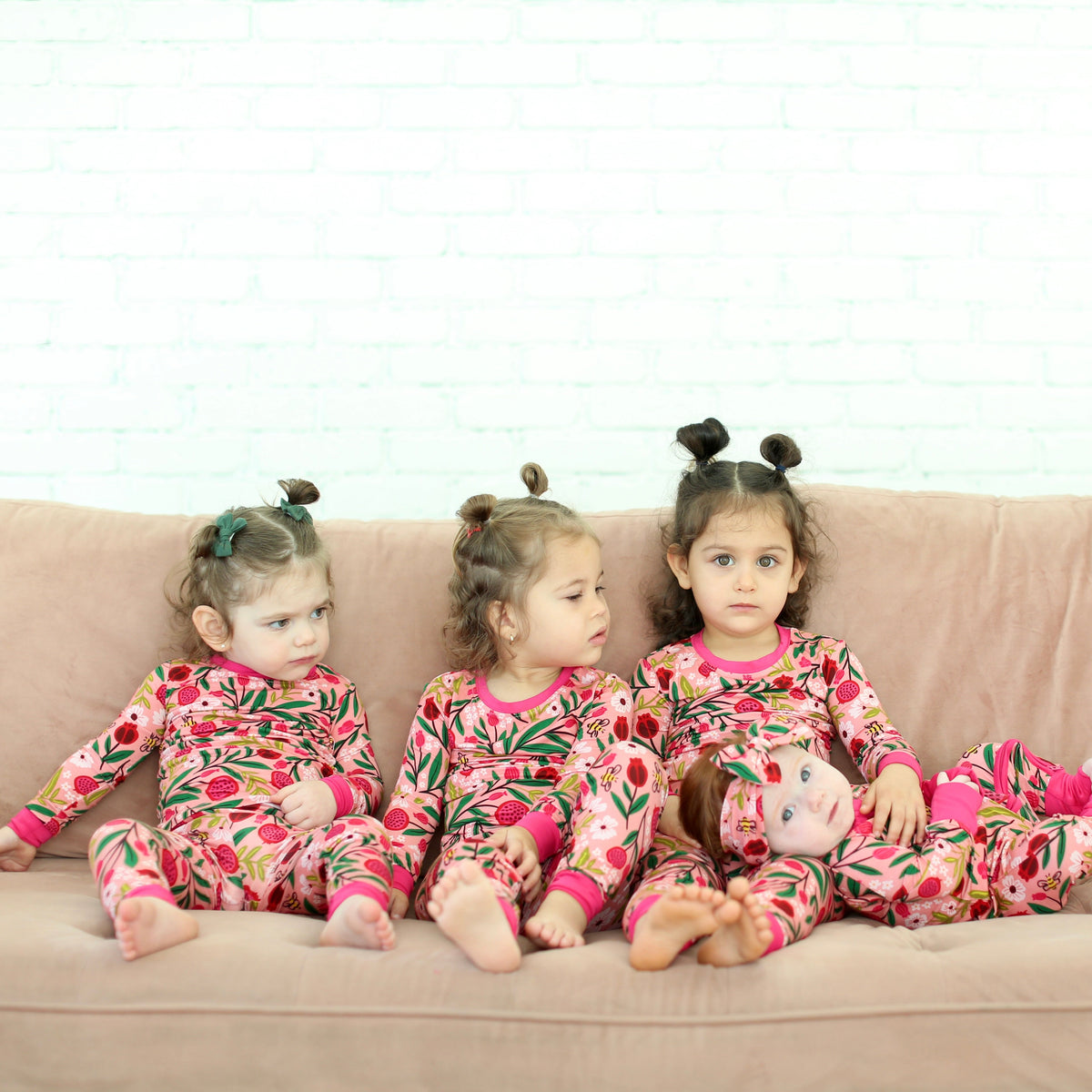 Three children wearing matching Petals & Pomegranates pajamas by Shiloh & Kate