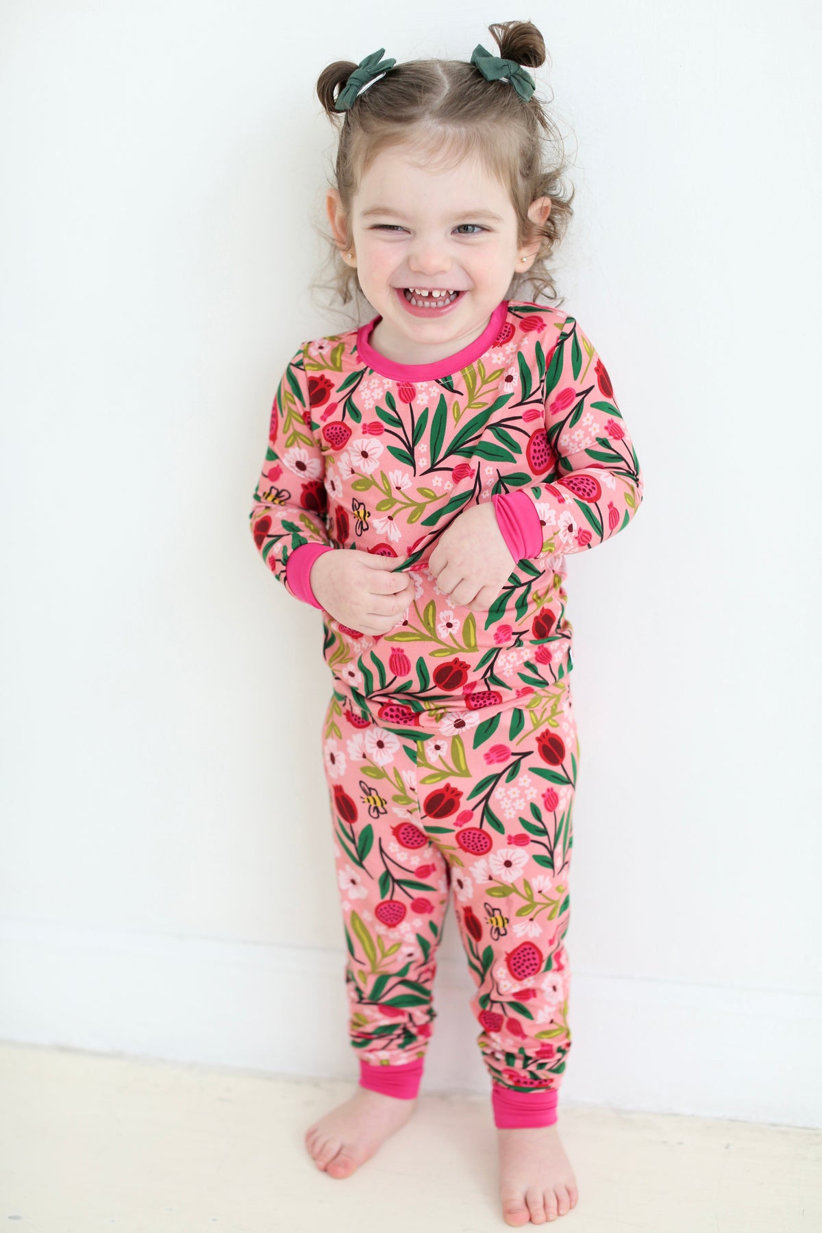 Full-length view of a child wearing the Petals & Pomegranates bamboo pajama set