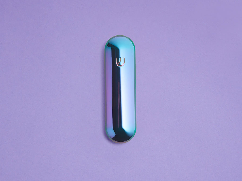 Iridescent Pill Mezuzah shown upright against a lavender background