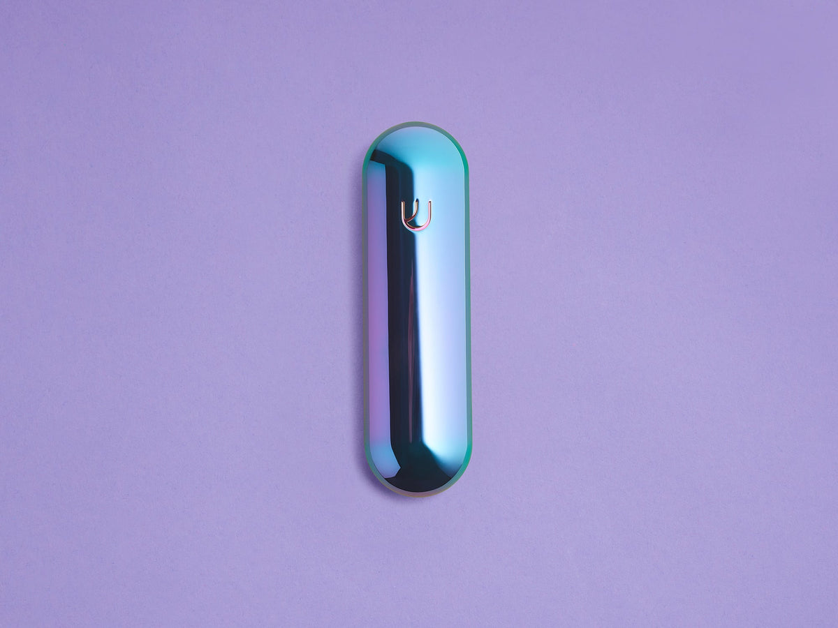 Iridescent Pill Mezuzah shown upright against a lavender background