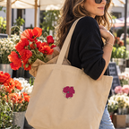 - Alt: Woman carrying embroidered poppy canvas tote filled with fresh poppies