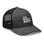 I’m That Jew™ Retro Trucker Hat in charcoal and black with white embroidery, angled view, by Eitan Chitayat