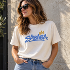 Woman wearing the Vintage White SABABA Graffiti Tee with blue lettering and gold crown graphic
