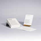 Shabbat conversation prompt cards displayed with brass stand by Oneg