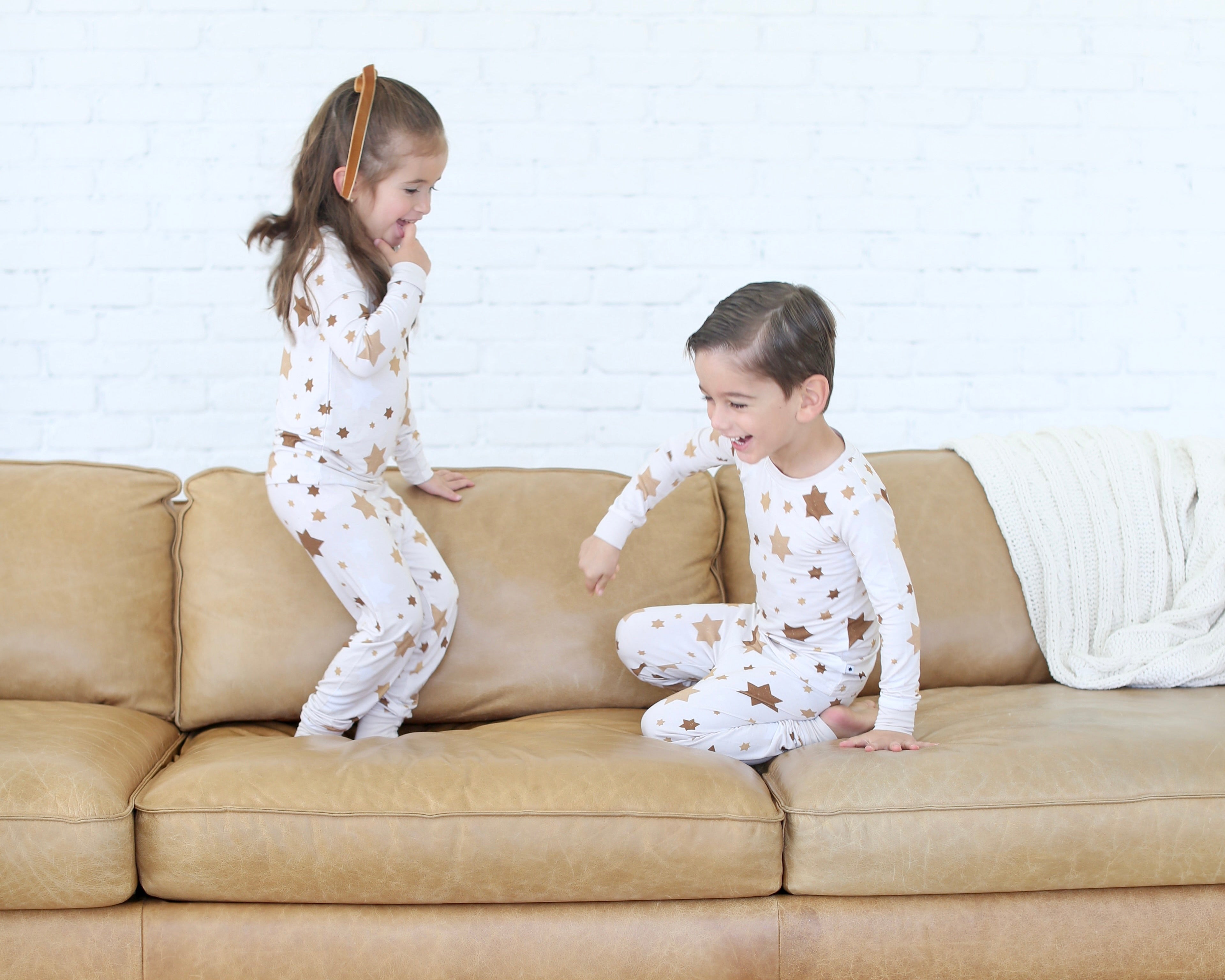 Children wearing Shiloh & Kate Star of David pajamas while playing together.