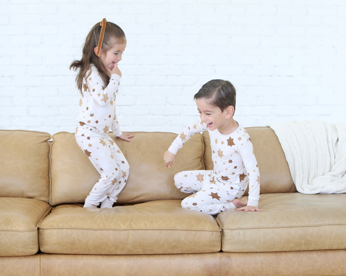 Children wearing Shiloh & Kate Star of David pajamas while playing together.