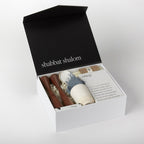 Open Signature Shabbat Box with Walnut candlesticks, Blue Linen challah cover and Shabbat essentials by Oneg