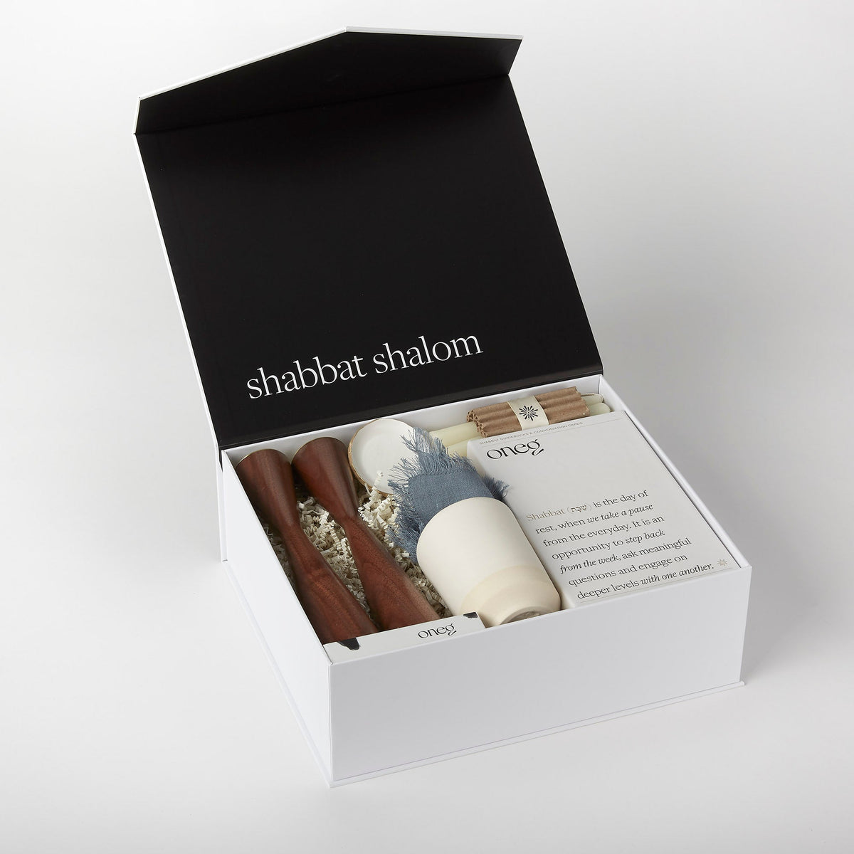 Open Signature Shabbat Box with Walnut candlesticks, Blue Linen challah cover and Shabbat essentials by Oneg