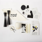 Signature Shabbat Box with White Linen challah cover, Black candlesticks, Kiddush cup, candles and Shabbat guidebook by Oneg