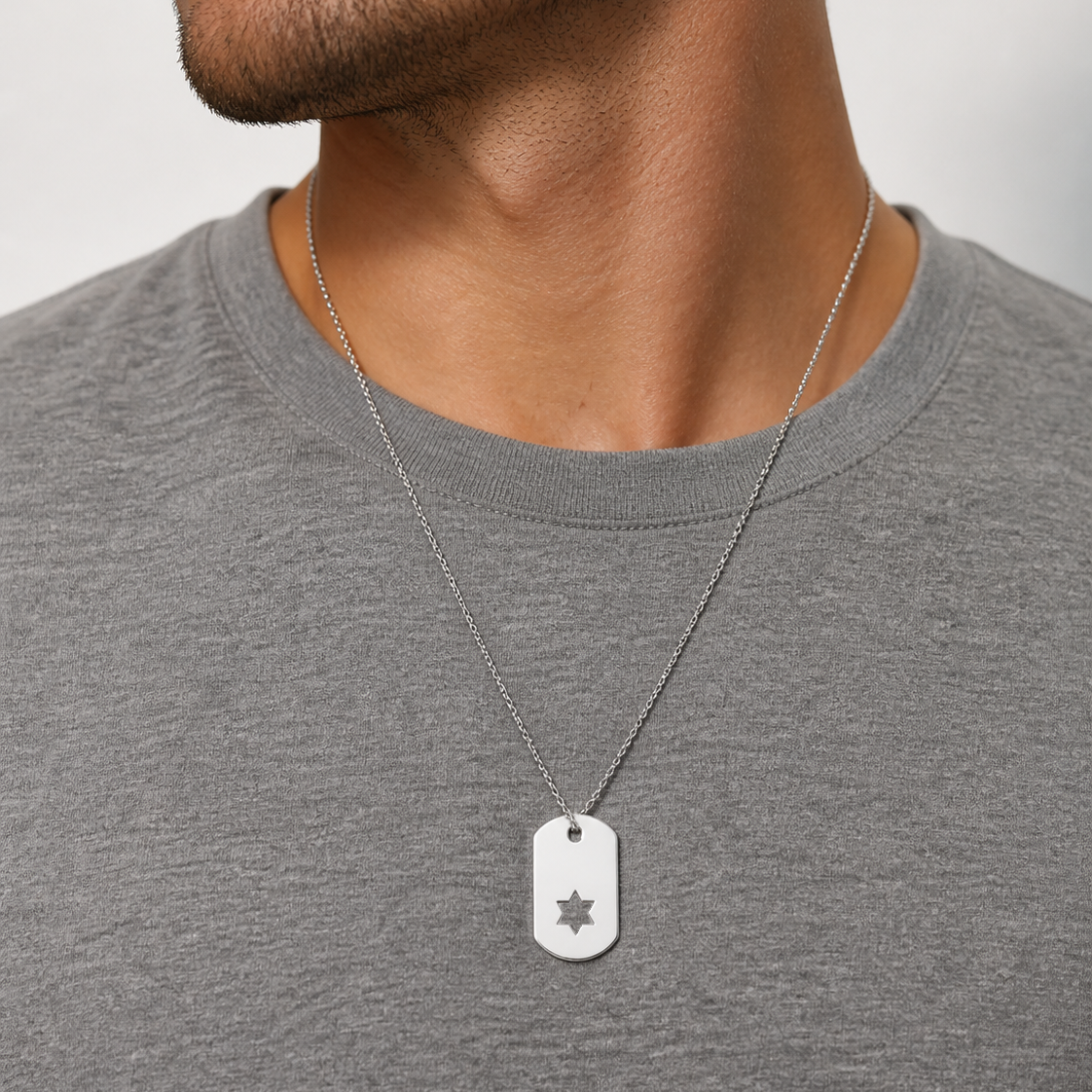 Sterling silver Star of David dog tag necklace worn by a man