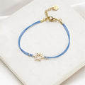 Light blue cord Star of David Bracelet with gold-plated charm by Shlomit Ofir