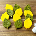 Handcrafted Sukkot marzipan etrogim and embossed green leaves by Marzipops
