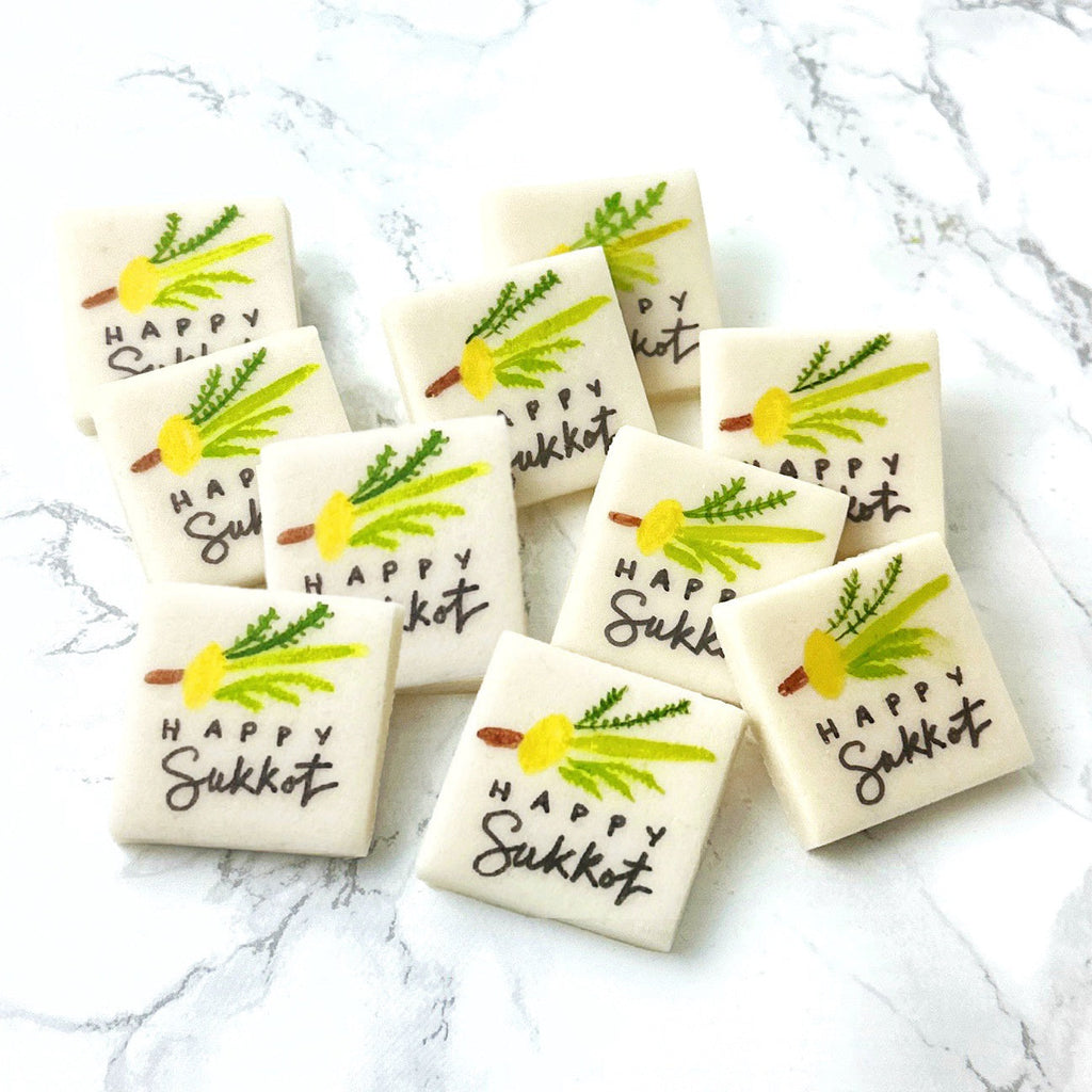 Assorted handcrafted Happy Sukkot marzipan place cards featuring the Four Species