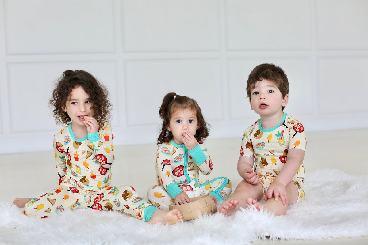 Three children wearing matching Taste of Israel pajamas by Shiloh & Kate