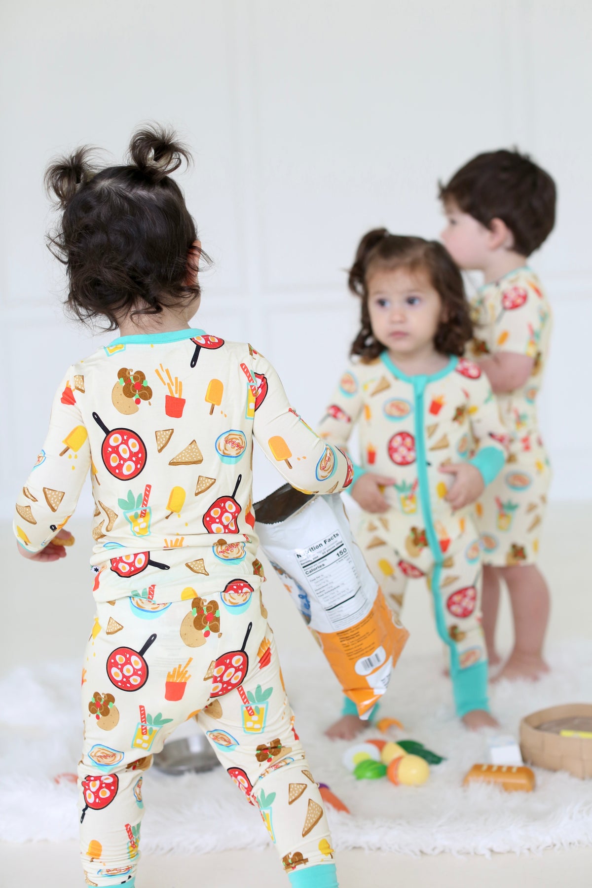 Back view of children wearing coordinating Taste of Israel pajamas