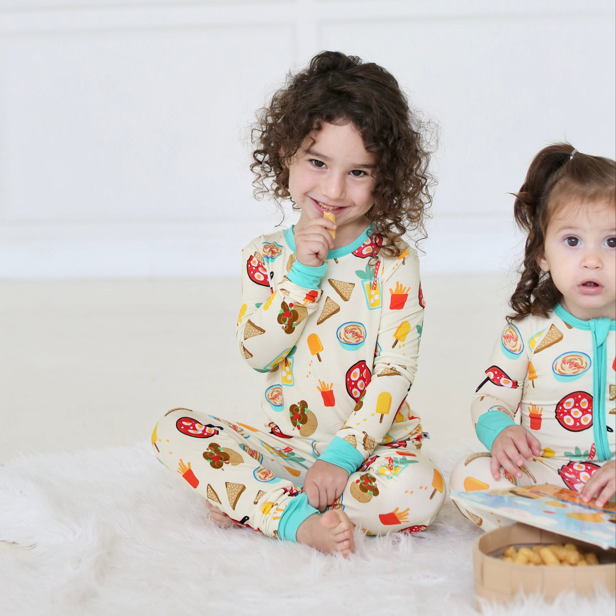 Children wearing matching Taste of Israel bamboo pajamas by Shiloh & Kate
