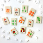 Thanksgiving marzipan mahjong tiles featuring pumpkins, autumn leaves, acorns and turkey designs