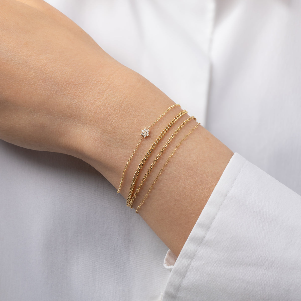Tiny Diamond Star of David Bracelet worn on wrist