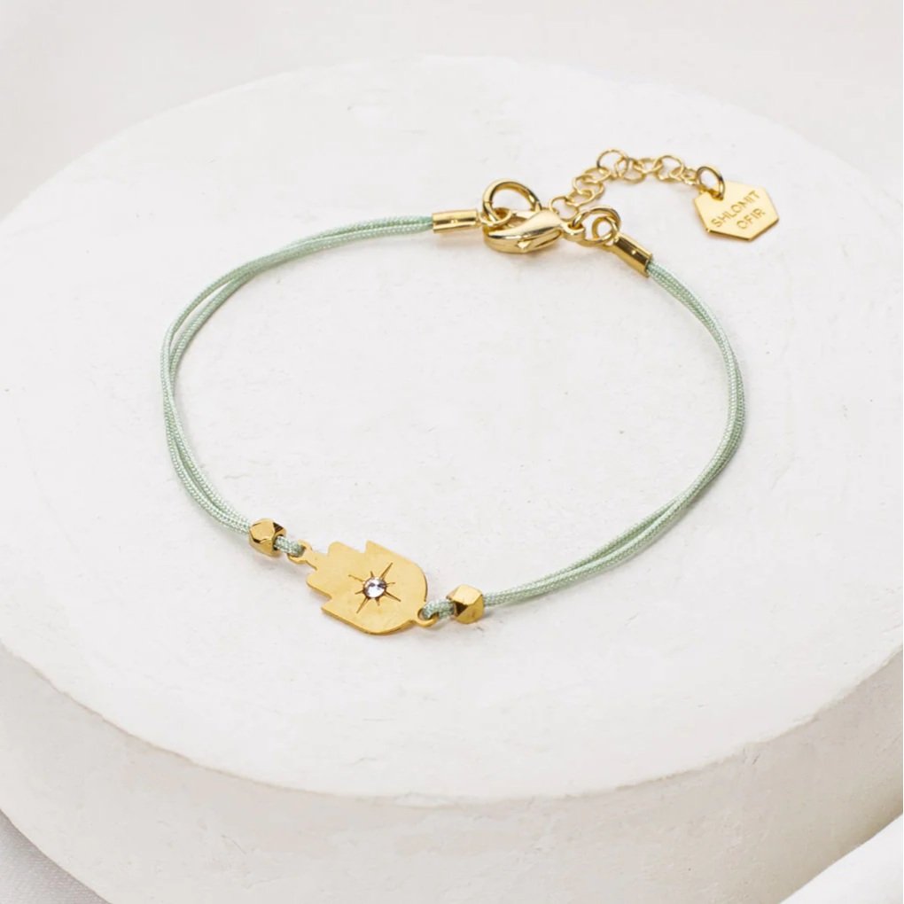 Aqua cord Tiny Hamsa Bracelet with gold-plated Hamsa charm by Shlomit Ofir