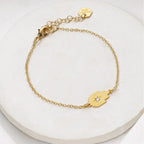 Gold-plated Tiny Hamsa Bracelet with zircon stone by Shlomit Ofir