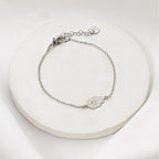 Silver-plated Tiny Hamsa Bracelet with zircon stone by Shlomit Ofir