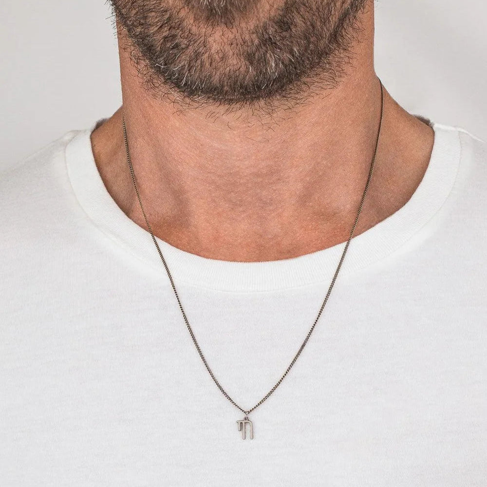 Unisex Chai Necklace worn by a man