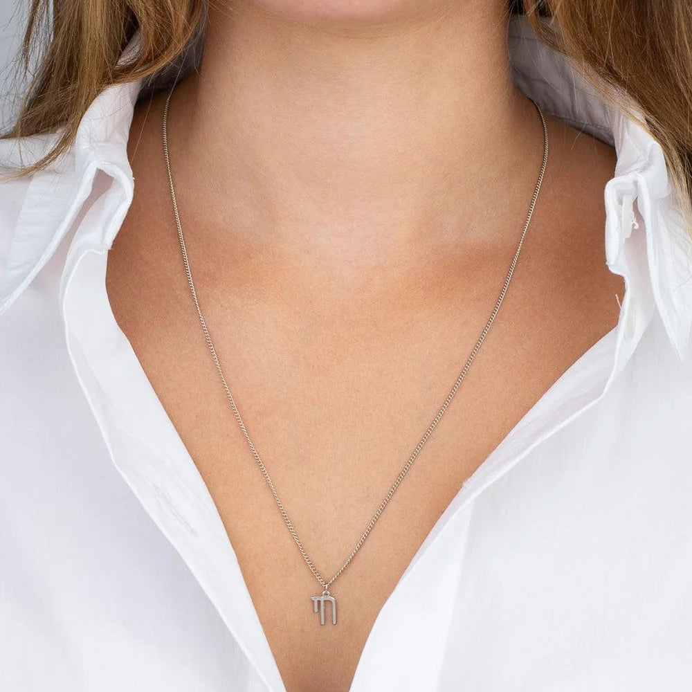 Unisex Chai Necklace worn by a woman