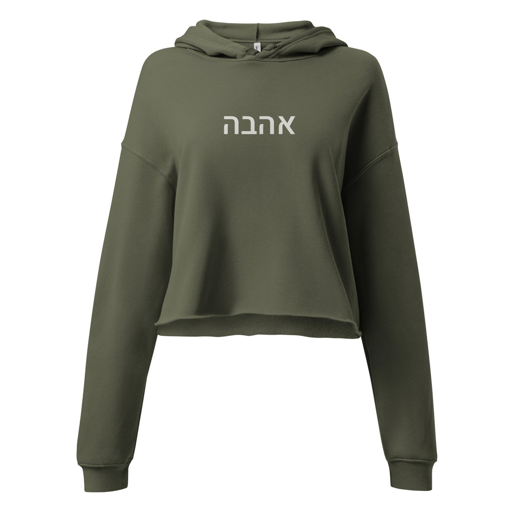 Olive green women's cropped hoodie with white Hebrew אהבה lettering across the chest, dropped shoulders, long sleeves, and a raw-edge hem.