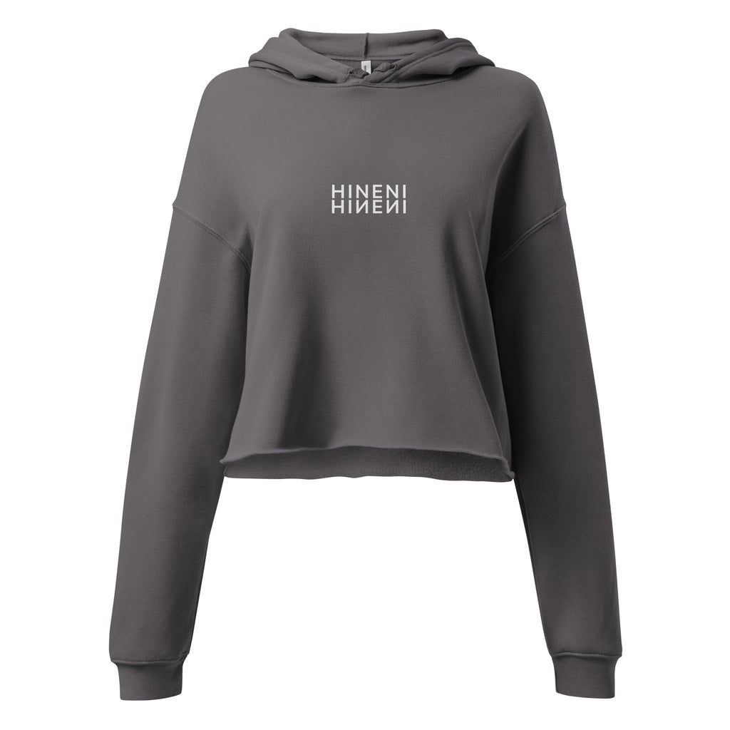 HINENI women's cropped hoodie in Storm with white mirrored lettering on the chest, dropped shoulders, and a raw-edge hem.